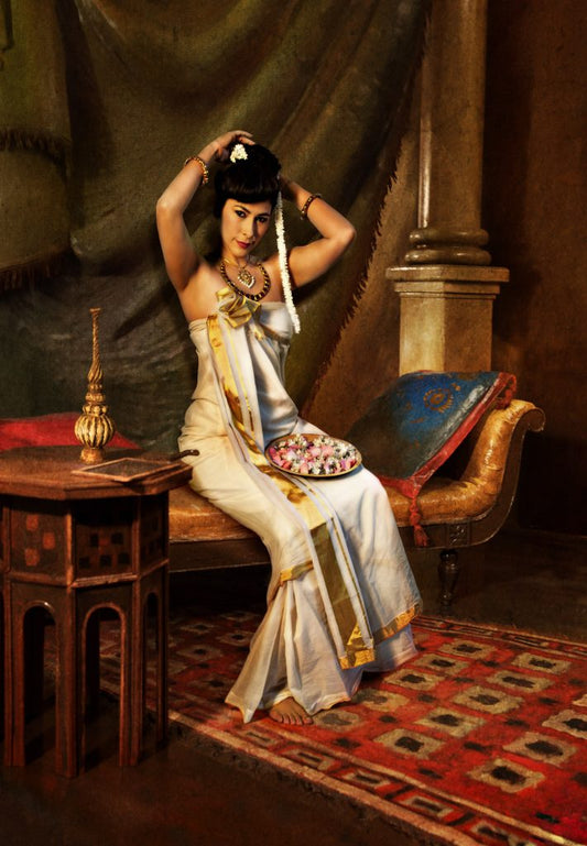 Nair Lady Arranging Jasmine in Hair Raja Ravi Verma